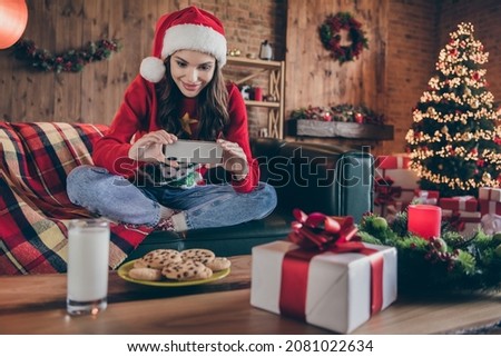 Photo of funny pretty young lady wear knitted sweater hat smiling tacking photo food drinks indoors house home room