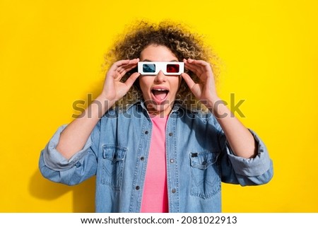 Photo of surprised lady imax movie special effects reaction wear 3d glasses jeans shirt isolated yellow color background