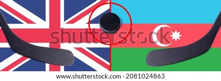 Top view hockey puck with United Kingdom vs. Azerbaijan command with the sticks on the flag. Concept hockey competitions