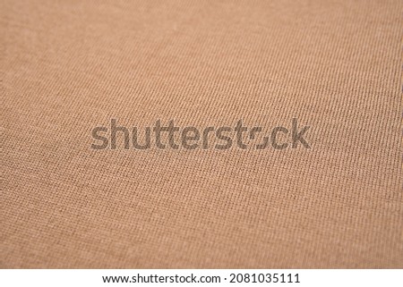 texture of beige merino wool clothes