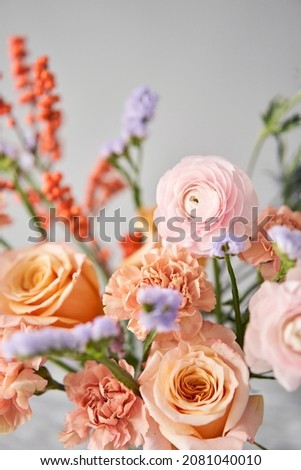 Finished flower arrangement in a vase for home. Flowers bunch, set for interior. Fresh cut flowers for decoration home. European floral shop. Delivery fresh cut flower. Royalty-Free Stock Photo #2081040010
