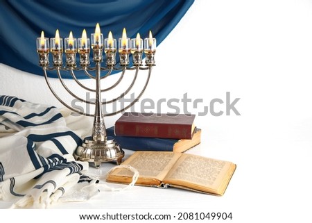 Jewish religious holiday Hanukkah with holiday Hanukkah (traditional candelabra), Religious books (Tanakh)