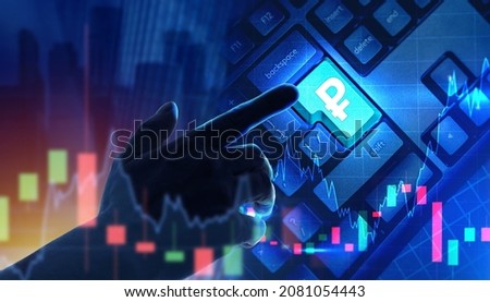 Investor clicks on button with Russian ruble logo. Ruble sign on keyboard as a symbol of investing in Russian Ruble. Rising and falling charts symbolize investing on Russian stock exchange. Royalty-Free Stock Photo #2081054443