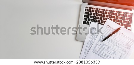 US Individual income tax return. US tax forms on desk. Wide image with copy space Royalty-Free Stock Photo #2081056339
