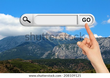 Human hand indicates the search bar in browser