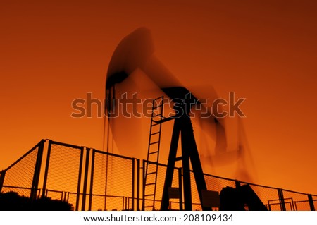 oil rig silhouetteworking at sunset lighting