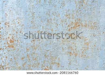 paint flakes on rusty metal sheet for background