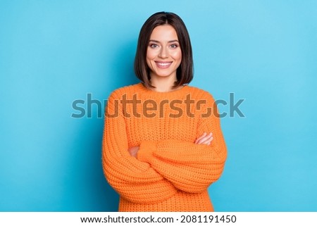 Portrait of attractive cheerful content girl folded arms wearing warm wool jumper isolated over bright blue color background Royalty-Free Stock Photo #2081191450