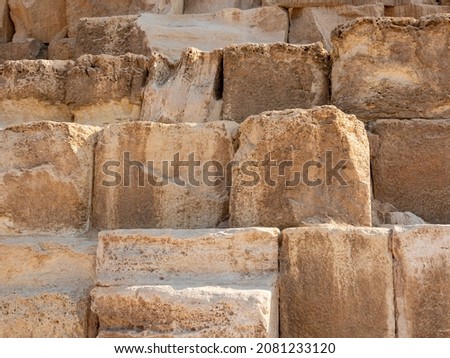 Pyramid of Cheops, the largest of the Egyptian pyramids. Close-up of stone blocks weighing more than 2 tons each. Giza, Cairo, Egypt.