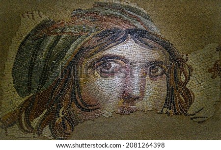 Gypsy girl mosaic in the Zeugma museum in Gaziantep, Turkey. The Museum is one of the largest mosaic collection in the world. The ancient city of Zeugma have been founded by Alexander the Great Royalty-Free Stock Photo #2081264398