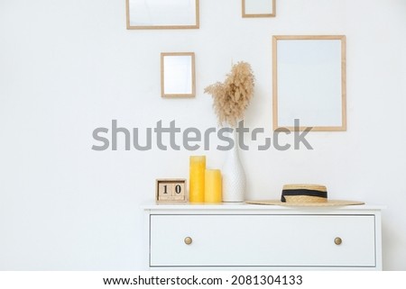 Interior of modern room with chest of drawers