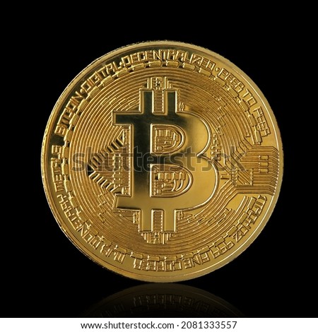 Golden Bitcoin isolated on black background