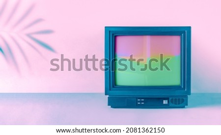 Minimal abstract vaporwave fashion concept 90s with tropical palm leaf shadow and vintage television box border. Pink-purple-blue neon background. Retro futuristic card idea. Frame made with tv. Royalty-Free Stock Photo #2081362150
