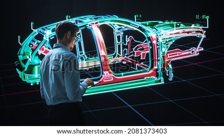 Innovative Green Energy Startup: Engineer Designing Electric Car Using Tablet Computer and Big Wall Screen to Analyse Prototype. Concept for Sustainable Environmnetally Friendly Carbon Neutral Vehicle