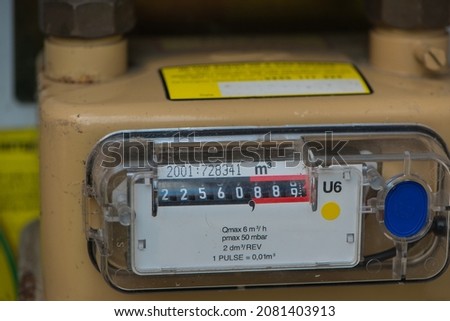 Residential natural gas meter dial showing amount of consumption . Close up view. Royalty-Free Stock Photo #2081403913