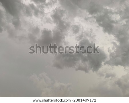 When the air rises, it creates an atmosphere. Gray stratocumulus clouds rise into the sky and change to Nimbostratus clouds. Heavy rain in Thailand. no focus 