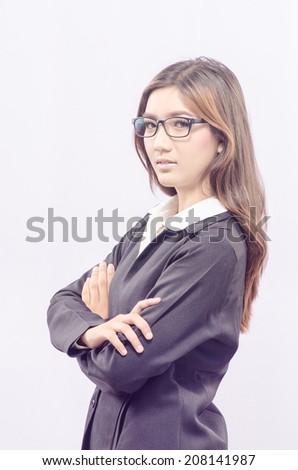 Asian Business woman with arms folded isolated on white background.