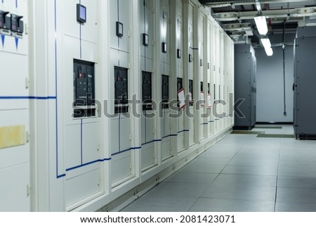 rows of closed servers in corridor of data center, cyber security concept