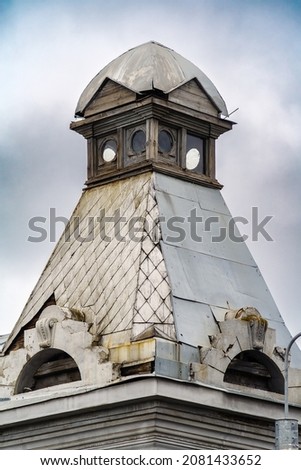 A corner turret on the roof of an old mansion. Architectural detail. The picture was taken in Russia, in the city of Orenburg