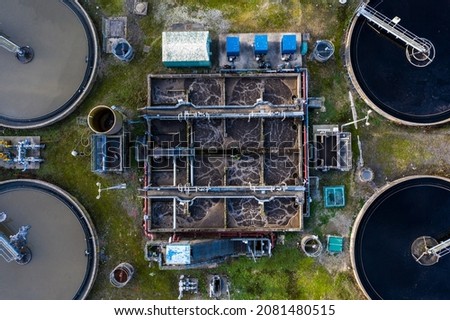 Aerial view of the tanks of a UK sewage and water treatment plant enabling the discharge and re-use of waste water and re-use of waste water