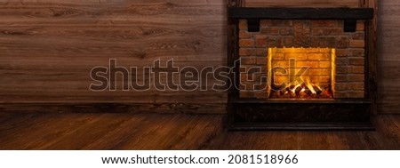 Fireplace in interior of a Log Cabins with wooden walls. Design banner with blank copy space on wooden wall