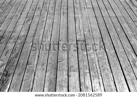 wooden sidewalk closeup in the day, black and white