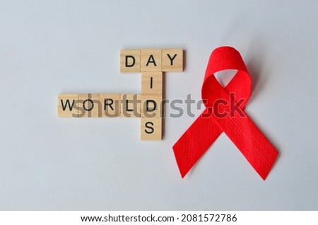 world aids day text on wood, isolated at white background