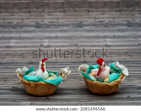 Easter eggs and chicken in a basket. Easter card with copy space for text.