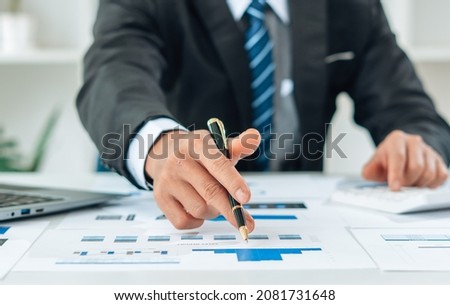 Close up view of bookkeeper or financial inspector hands making report, calculating or checking balance. Home finances, investment, economy, saving money or insurance concept.