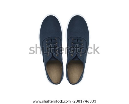 Blue pair of sneakers on a white background. View from above.