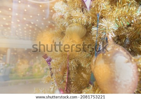 Closeup, Christmas tree and decorations, balls, gifts, cards and snowman. hanging in the atmosphere of happiness and snow white