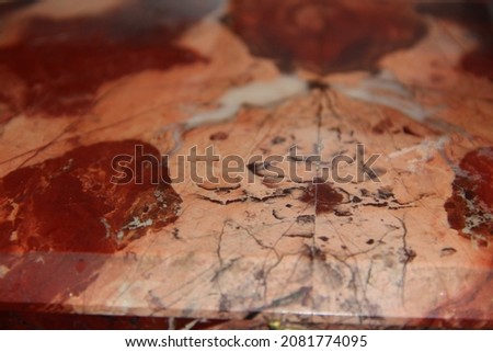 Red-pink marble surface with abstract pattern. Backgrounds