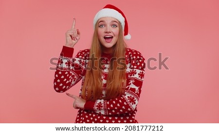 Eureka. Girl in red Christmas sweater make gesture raises finger came up with creative plan feels excited with good idea, inspiration motivation isolated on pink background. Happy New Year celebration