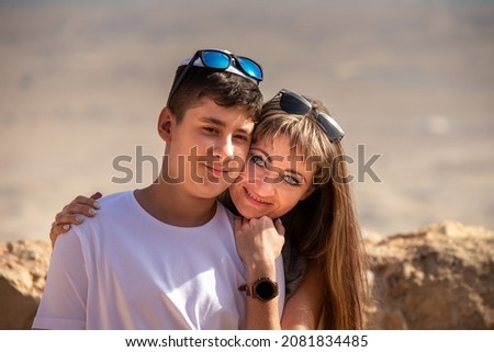 Mom congratulates her son on the bar mitzvah, which took place on Mount Masada in Israel.
