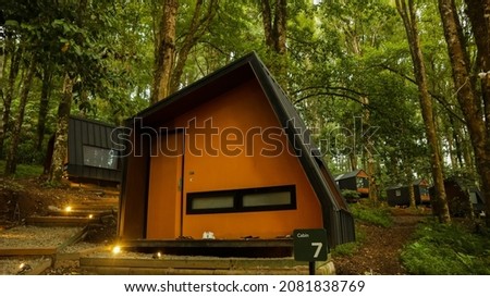 Unique cabin shape that is comfortable in the middle forest at Bobocabin Ranca Upas, Indonesia Royalty-Free Stock Photo #2081838769