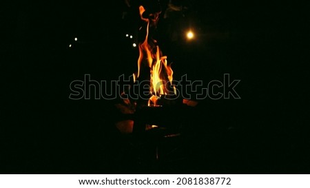 Night campfire in the winter forest Royalty-Free Stock Photo #2081838772