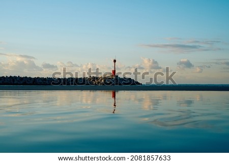 a lighthouse at the ocean                       