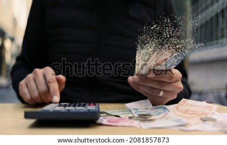 hand holding money. Financial crisis concept. suitable for money, economy, finance and bank themes. Royalty-Free Stock Photo #2081857873