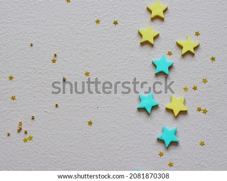 wooden stars on wooden colored background. Christmas decoration. Symbol of holiday. Stars.Top view flatlay . background for children's party. Design of Greeting Card With Christmas stars.