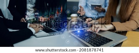 Business Team Corporate Marketing Working Concept. Business partners using laptop and digital tablet with virtual interface icons network diagram, Blurred background.