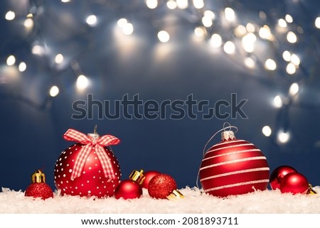 Magic holiday background with christmas balsl, bokeh lights over blue background