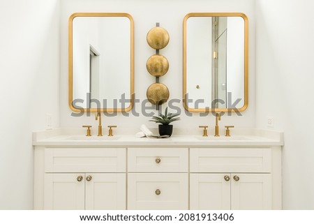 Modern White Bathroom with Gold Fixtures and Accents Royalty-Free Stock Photo #2081913406