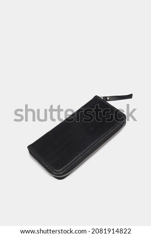 black men's wallet on a gray background