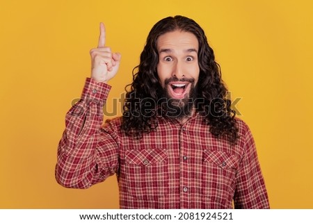 Photo of excited genius man finger close lips ask keep silence wear checkered shirt isolated on yellow color background