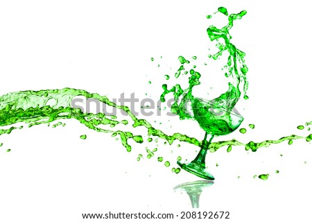 Drink green splashes coming from the glass on a white background