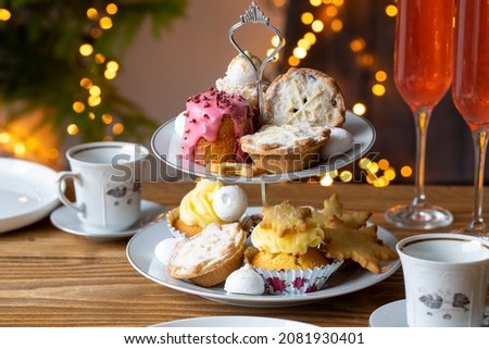 Christmas afternoon tea with mince pies, cakes and biscuits Royalty-Free Stock Photo #2081930401