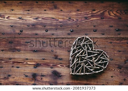 Wooden handmade heart decor on a vintage wooden background
