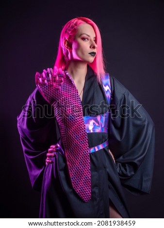 Fashion of the future, multicultural outfit with elements printed on a 3D printer. Stylish young woman with pink hair and black lips in a gothic cyber image, 3D printing and a classic kimono Royalty-Free Stock Photo #2081938459