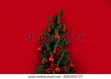 toy Christmas tree on a red background 