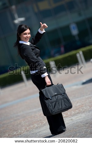 young businesswoman going to work with the thumb up